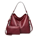 Macro detail of wine red oil-wax leather tote and matching zipper pouch set - Fuschia