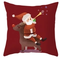 Close-up of Santa Claus riding a reindeer printed on a dark red festive pillowcase - DRD247-13 (Dark Red Reindeer)