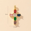 Macro detail of gold-plated cross pendant with colorful zircons and 3x1.7cm dimensions - Style O-Mini Colorful Zirconia Cross
