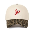 Close-up of lobster embroidery and leopard print brim on a cotton baseball cap - Leopard Print