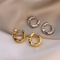 Textured gold and silver hoop earrings set on silk background with lava-like ripple finish - E5787 Silver Lava Textured Hoops