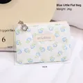 Blue floral lace makeup pouch with zipper closure and brand label on white background - Small Flat Bag / Blue