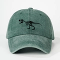 Close-up of vintage green washed cotton baseball cap with black dinosaur skeleton embroidery - Dark Green