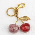 Sparkling cherry keychain with pink and red sequins, gold plating, and a lobster clasp - Champagne Red Cherry with Bronze Hardware