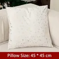 Linen Christmas pillowcase 45x45cm with gold star patterns on a cozy white sofa - Gold Dandelion