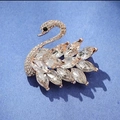 Elegant swan brooch with marquise-cut crystals and gold finish for suit lapels - White Swan