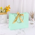 Mint green paper gift bag with gold satin bow and woven handles for shopping - 28*9*20cm / Light Green