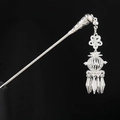 Detailed view of silver Hmong hair pin featuring intricate filigree and swaying tassels - 19-Hairpin Lady Hairpin
