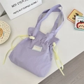 Detail of lavender canvas tote bag with yellow drawstring ribbon and Sorakka Studio label - Light Purple
