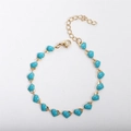 Detail of 18k gold plated heart bracelet featuring vibrant turquoise enamel charms - Lake Blue