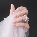 Short square pink press-on nails and silver rings with pearl detail on hand - Shiny Flesh Pink (DFL-08)