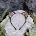Detail of handmade cat ear headband with champagne crystals on a natural rock background - Tawny Cat Ears
