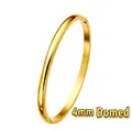 Detail view of 4mm domed gold bangle featuring a high-polished mirror finish surface - Simple Domed Surface (Gold) / 4mm Width