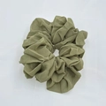 Close-up of a green chiffon scrunchie with high elasticity and elegant pleated texture - Green (2-8)