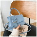 Sky blue crossbody bag with minimalist square buckle and elegant top handle - Blue