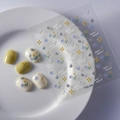 Daisy and butterfly embossed nail art stickers with Hello Dream text on white tray - Fresh Blue Yellow Floral Butterfly (FEB-484)