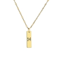 Detailed macro view of a gold-plated rectangular pendant with a colorful stone-set letter M - Letter M