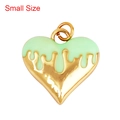 Small heart pendant with mint green enamel drip and golden metal base on white background - Drip Heart Green Small
