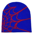 Macro detail of blue knitted beanie featuring a red jacquard spider web pattern texture - Royal Blue with Red Web
