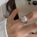 925 silver liquid metal ring with irregular pearl on female hand in a modern lifestyle view - J2607 Irregular Pearl Style