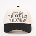 Close-up of black embroidery on contrast canvas baseball cap with slogan detail - One Size / Cream/Black