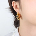 Chic 18K gold plated C-shape hoop earrings with black enamel stripes on female model - Gold Black Enamel Hoop Earrings
