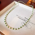 Detail of gold plated pearl and green bead necklace inside a wooden jewelry tray - Short Style (Real Gold Plated)