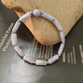 Close-up of natural amethyst beaded bracelet with purple square stones and silver beads - Aquamarine