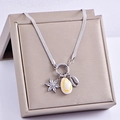 Silver snake chain necklace with shell and starfish pendants on a gold jewelry box - Petal Shell Style (Steel Color)
