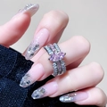 Detail view of pear-shaped pink zircon on multi-layer silver ring with micro-pave stones - Pink Marquise Cross (JZ3899)