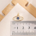 Macro view of Evil Eye pendant with zircon inlay and measurement scale for size reference - E0014G