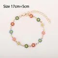 Golden daisy bracelet featuring colorful enamel flowers with 17cm plus 5cm extension - Multicolor Daisy (Gold Tone)