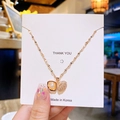 Collier doré avec pendentif coquillage serti de zircons et perle blanche élégante - Perle Coquillage Ouvrable Or Rose