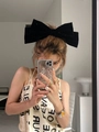 Elegant large black velvet bow hair clip worn by a model in a modern setting - 24# Oversized Velvet Bow - Black