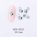 Close-up of 6x11mm white tulip nail charms with alloy base and green leaf detail - White Flower White K Base (8522)