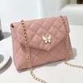Pink quilted crossbody bag with white butterfly charm and gold chain strap for women - Pink