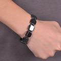 Polished magnetic hematite bracelet featuring square flat beads for men on wrist - Magnetic Cut Corner Row with Beads Bracelet