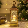 Bronze Christmas lantern with snowman and children figures, LED light and glitter effect - Snowman and Child