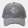 Detailed close-up of white embroidery on gray corduroy baseball cap with text slogan - One Size / Gray