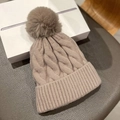 Thick cable knit beanie with faux fur pom-pom in light brown for winter warmth - One Size / Khaki