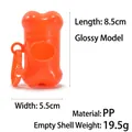 Orange bone-shaped pet waste bag dispenser made of durable PP plastic with hanging clip - Orange