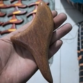 Ergonomic sandalwood triangle gua sha tool in natural reddish brown wood finish - Dragon Phoenix Sandalwood - Triangle Sparrow