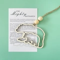 Hollow bear silhouette wooden pendant with beads and twine on a mint green background - Bear with Card