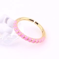 Detailed shot of gold adjustable ring with pink enamel spiral texture on ice cube - Adjustable Open / Pink
