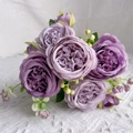 Artificial bouquet with seven purple Austin roses and green leaves on lace fabric - 5-Head Peony / Purple