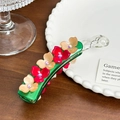 Acetate banana hair clip in green featuring elegant red and beige floral rhinestones - Green