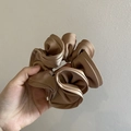 Elegant champagne silk satin scrunchie with a glossy finish and vintage ruffled design - Brown
