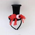 Detail of Halloween mini witch hat headband with red burlap bow and spooky eyeball - Black/Red