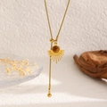 Detail of golden sunburst pendant with brown tiger eye stone on sleek snake chain - Sun Radiating Texture Style (11018)