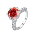Luxurious S925 silver ring featuring a large round red gemstone and small pavé diamonds - US 8 / 2CT Orange Red Moissanite